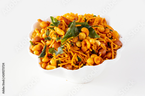 South indian spicy crunchy mix Nimco or Namkeen white bowl background isolated.
