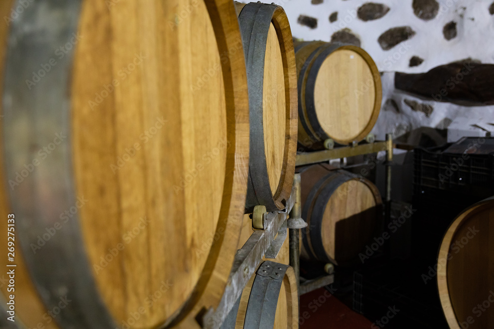 Close-up of Wooden Barrels in oak Stored At Wine Cellar