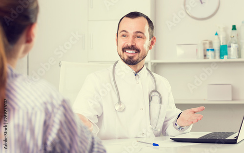 Positive man doctor with female client
