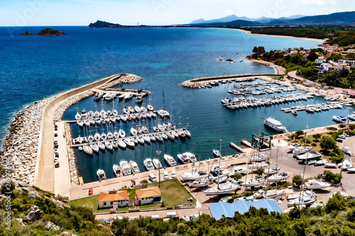 Sardinia, Italy - The modern tourist harbor of Baunei and Santa Maria Navarrese, is one of the most popular harbors, on the east coast of the island of Sardines, on a sunny day in May.