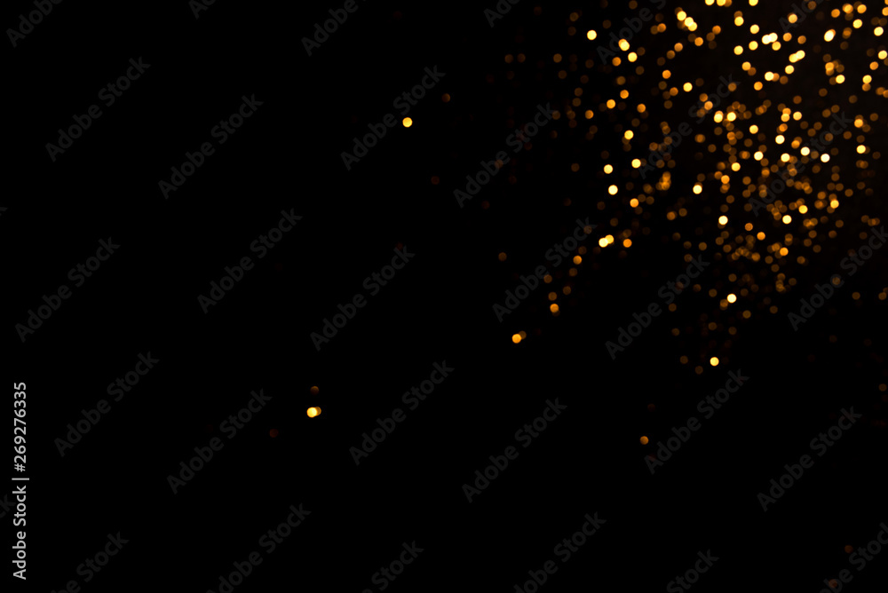 Gold abstract bokeh. Black background. Holyday concept