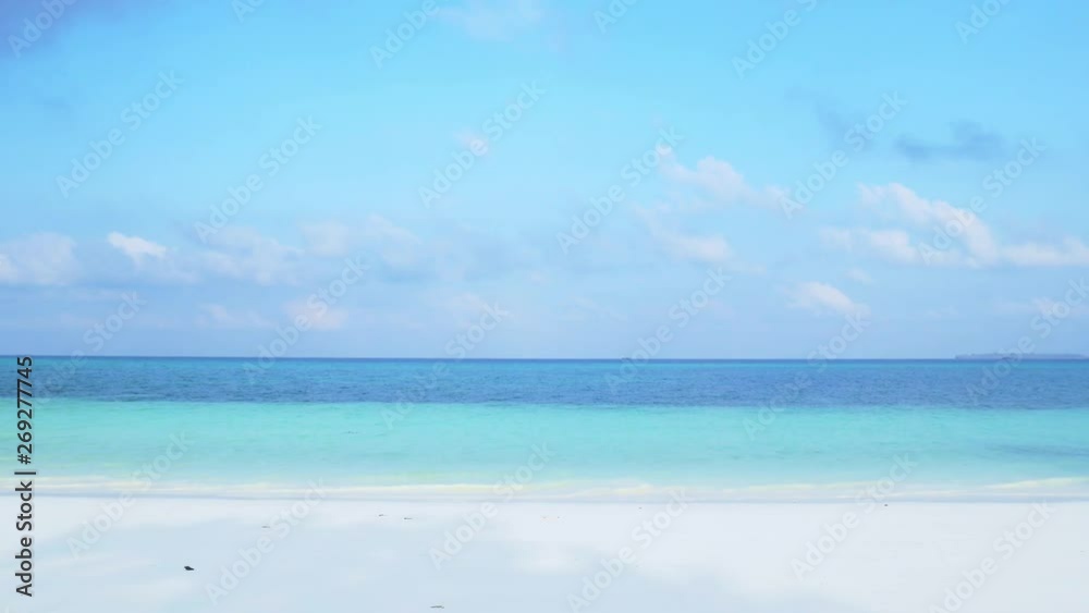 Waving caribbean sea turquoise water white sand beach sunny tropical coastline idyllic nobody at Pasir Panjang Kei Islands Indonesia Moluccas Maluku Indonesia 
