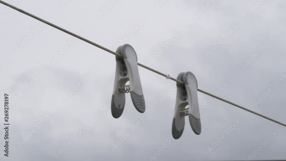 2 Pegs Blowing on Clothes Line 2 Pegs Blowing on Clothes Line