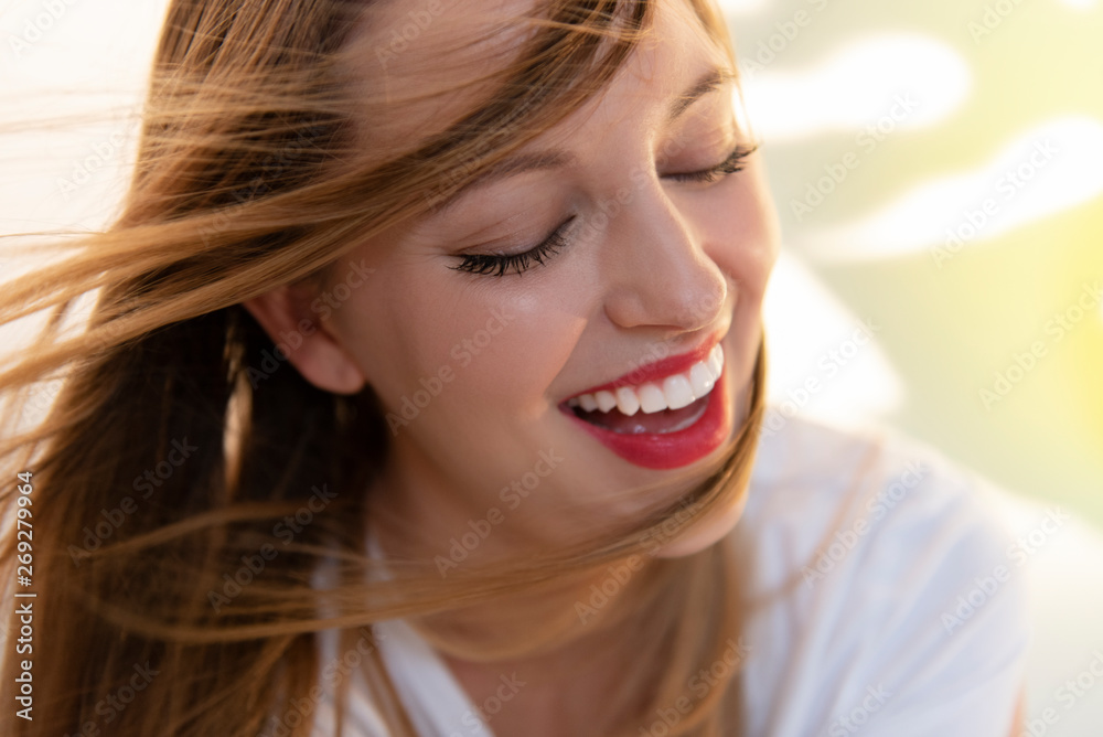 Portrait of windswept young woman wearing red lipstick Portrait of windswept young woman wearing red lipstick