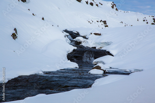 Brook in the snow in the highlands of Iceland © Jens