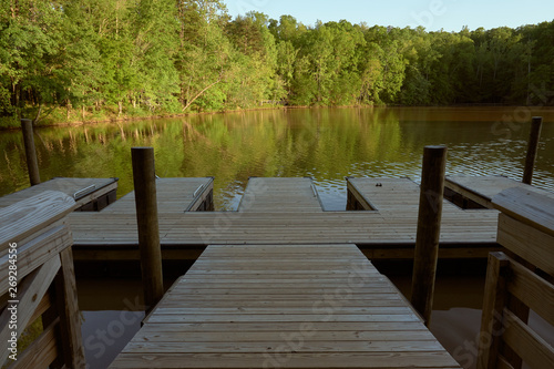   FORT MILL, SOUTH CAROLINA/UNITED STATES – APRIL 27, 2019: Fishing dock on the lake at Anne Springs Close Greenway in Fort Mill, South Carolina.     