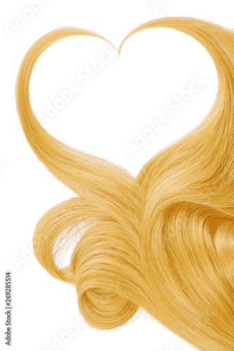 Blond hair in shape of heart, isolated on white background