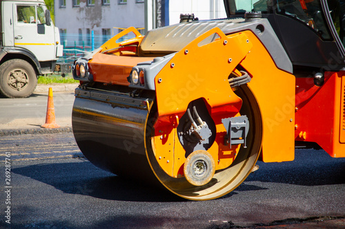 Repair of roads. Laying asphalt using a roller. © Александр Поташев