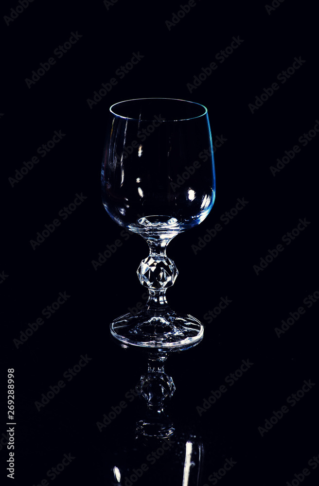 Empty wine glass. isolated on a black background Empty wine glass. isolated on a black background