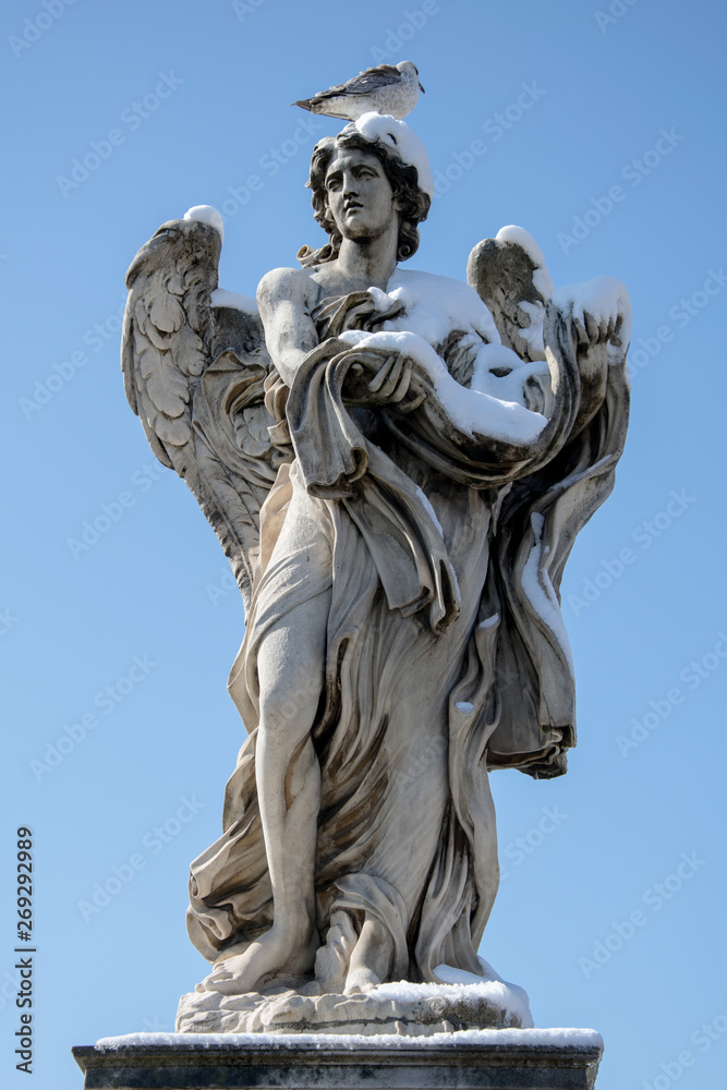 Angel statue in Rome - Italy - in winter with snow