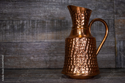 Old ancient antique artistic pitcher container for liquid. © Josif