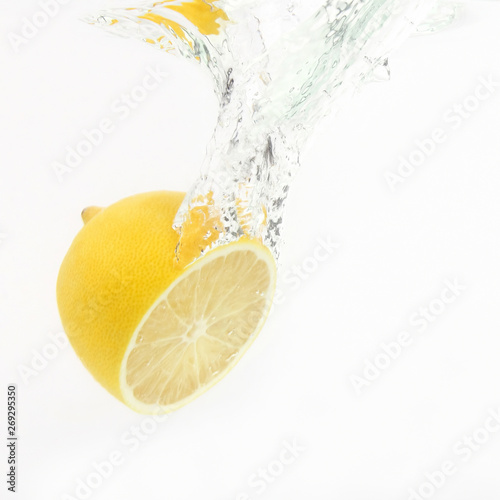 lemon drops of water on white background
