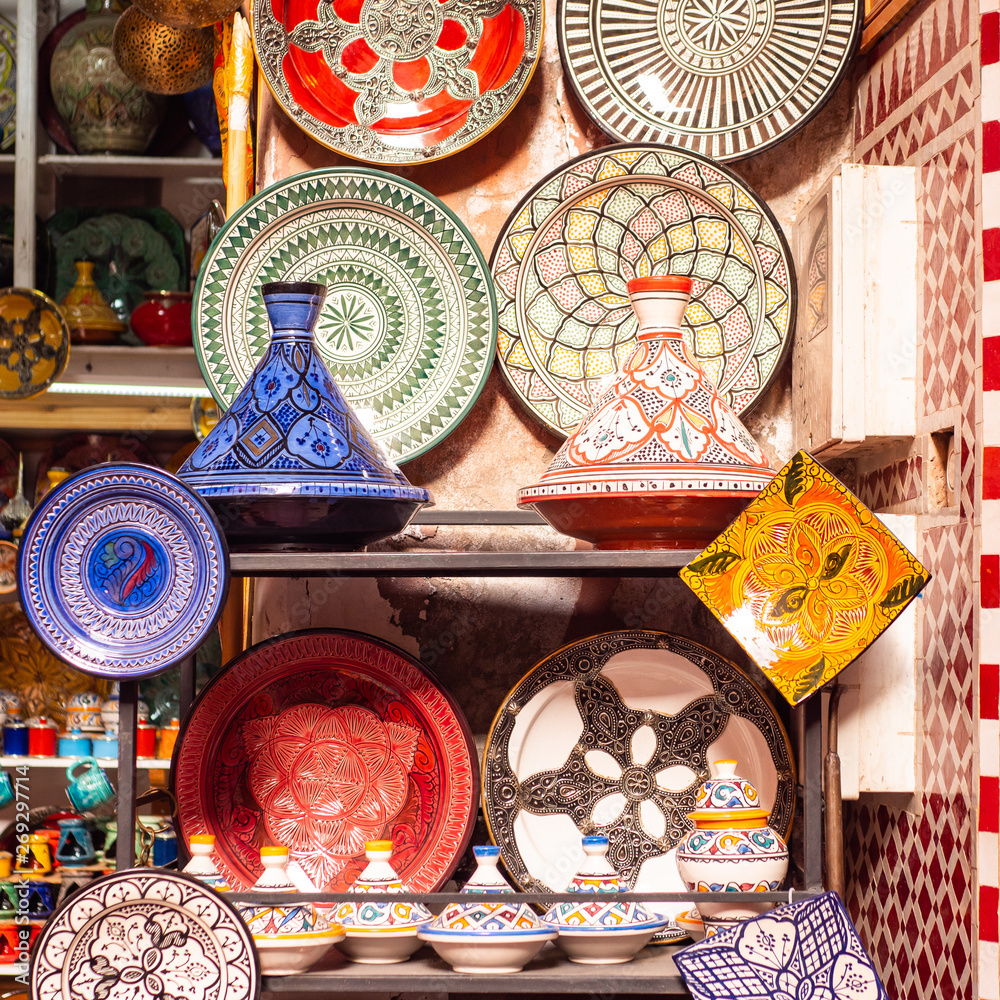 Traditional Moroccan marrakech market with plates and tajin tagine. Handmade ceramic plates. Arabian colorful ramadan design Traditional Moroccan marrakech market with plates and tajin tagine. Handmade ceramic plates. Arabian colorful ramadan design