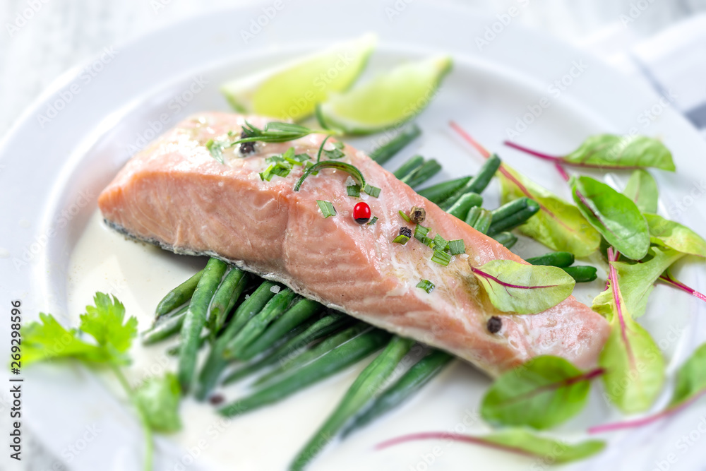 Steamed cooked salmon and vegetables. Lunch, fillets.