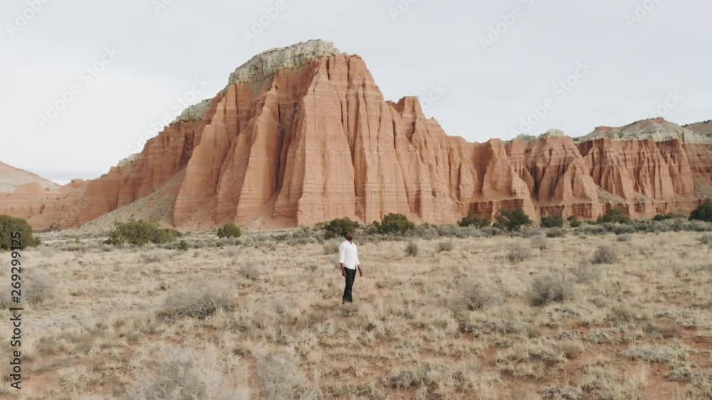 Aerial Orbit Man Isolated In Breathtaking Utah Desert Landscape. Aerial Orbit Man Isolated In Breathtaking Utah Desert Landscape.