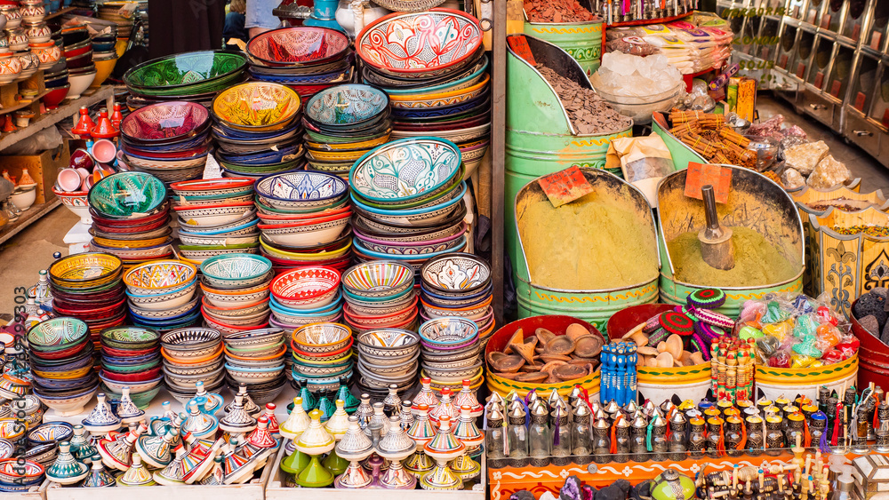 Traditional Moroccan marrakech market with plates and tajin tagine. Handmade ceramic plates. Arabian colorful ramadan design