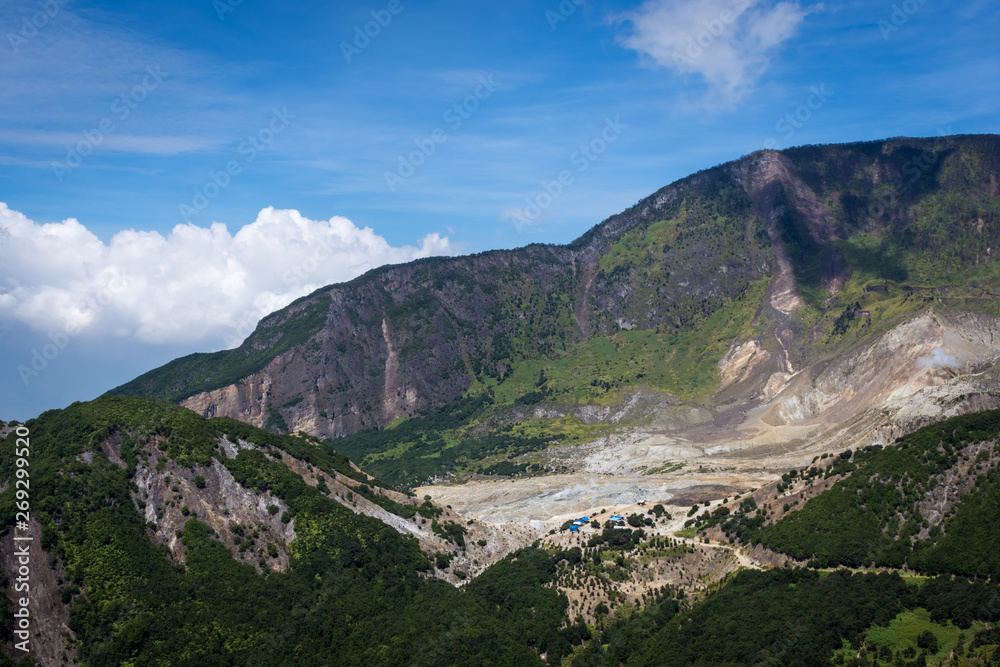 A scenic view of mountain Papandayan with clear blue sky. The view of Tebing Soni and Papandayan Crater. Papandayan Mountain is one of the favorite place to hike on Garut.