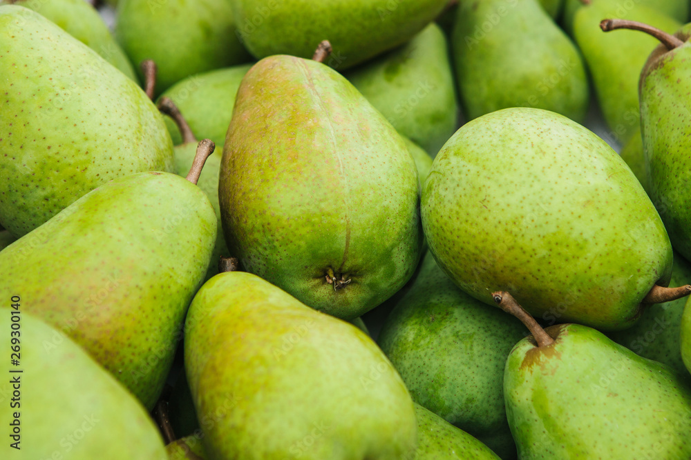 Close-up. Lots of fresh green pears background. Close-up. Lots of fresh green pears background.