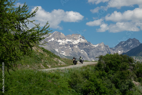 Tourists on motorcycles explore the scenic French countryside in the summertime.