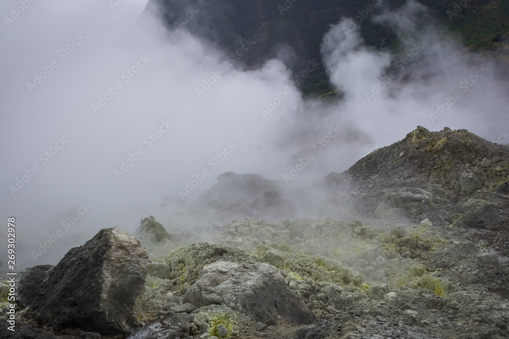 view of crater on active mountain with sulfur gas come out from stone. Beautiful landscape of mount Papandayan. Papandayan Mountain is one of the favorite place to hike on Garut.