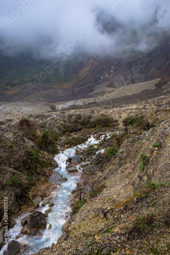 Rocky stream with white water on a mountain. Beautiful landscape of mount Papandayan. Papandayan Mountain is one of the favorite place to hike on Garut.