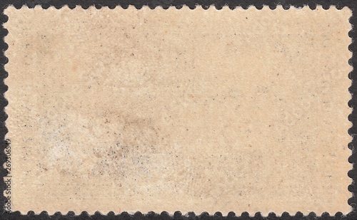 The reverse side of postage stamp with a damaged adhesive layer,background