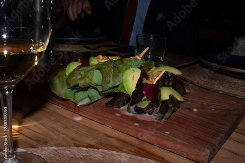 Salad prepared in avocado spinach baby and cream of mezcal for pairing with white wine