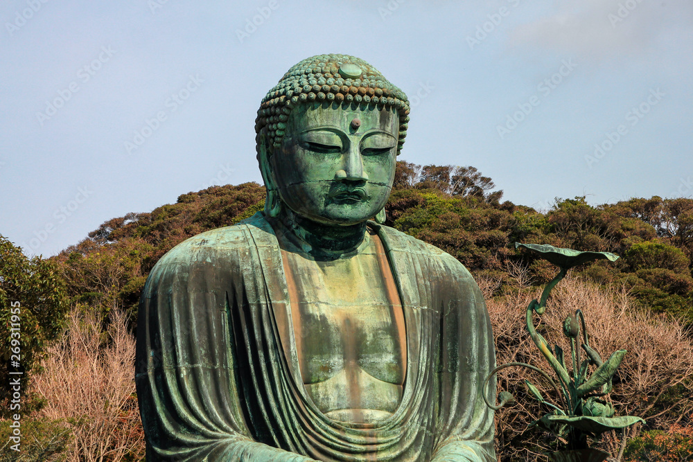 Famous fascinating bronze statue of Great buddha is located on the ground of Kotokuin Temple, Kamakura, Japan. Famous fascinating bronze statue of Great buddha is located on the ground of Kotokuin Temple, Kamakura, Japan.