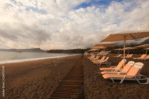 beach with chairs and umbrellas