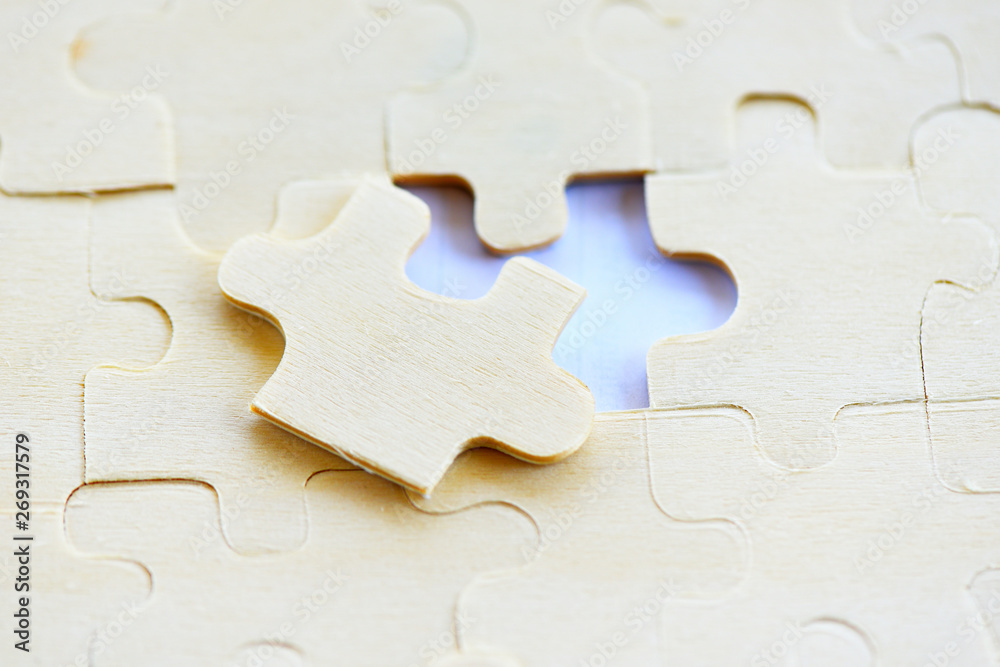 Jigsaw puzzle on white background top view - jigsaw piece connecting business solutions success and strategy concept Jigsaw puzzle on white background top view - jigsaw piece connecting business solutions success and strategy concept