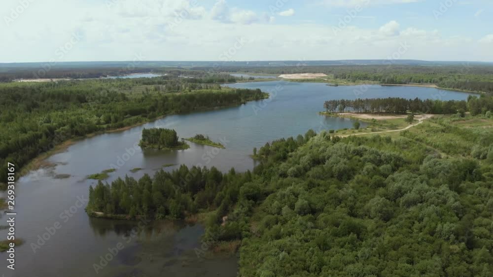 Aerial View. Flying camera over beautiful lakes and green forests. Flying over the beautiful lake. Aerial camera shot. Landscape panorama. 4K Aerial View. Flying camera over beautiful lakes and green forests. Flying over the beautiful lake. Aerial camera shot. Landscape panorama. 4K