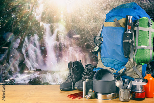 Travel equipment for a mountain trip . Adventure collection of compas, container, flask and knife. Travel and survival kit.