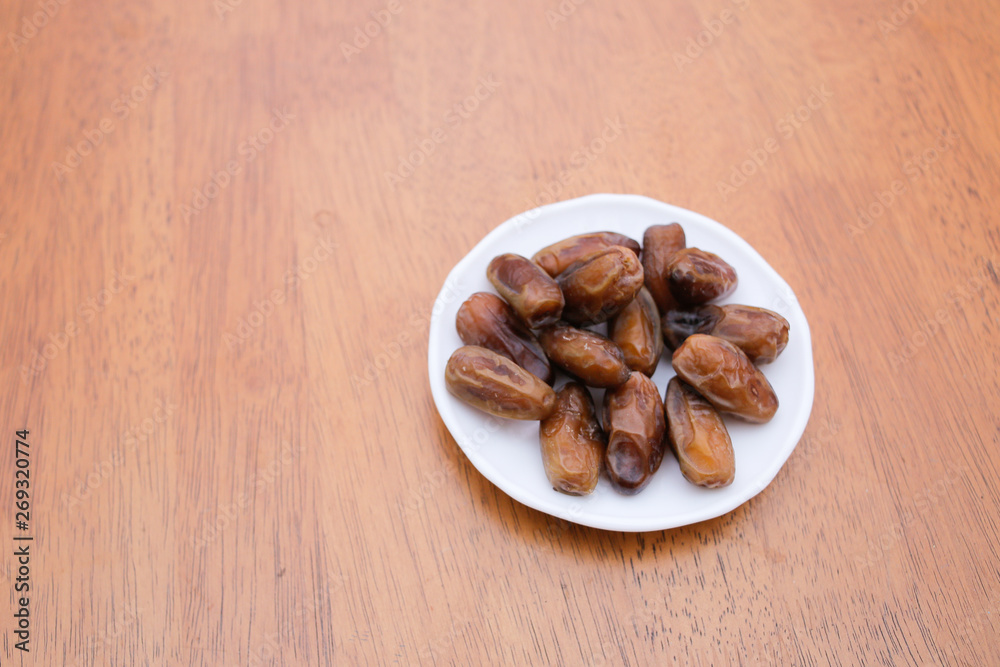 Date palm fruit or kurma on top of the dish Date palm fruit or kurma on top of the dish