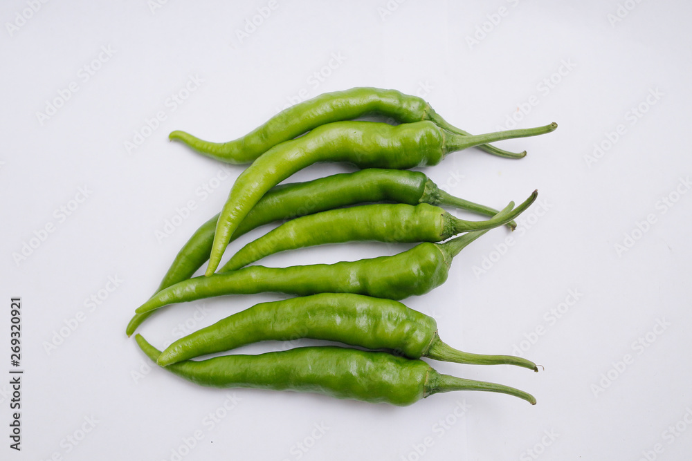 Fresh green chili peppers isolated on white background Fresh green chili peppers isolated on white background