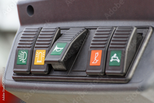 Operating control panel with buttons in truck or agricultural machine
