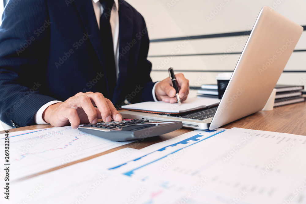 strategy analysis concept, Businessman working financial Manager Researching Process accounting calculate analyse market graph data stock information review on the table in office. strategy analysis concept, Businessman working financial Manager Researching Process accounting calculate analyse market graph data stock information review on the table in office.