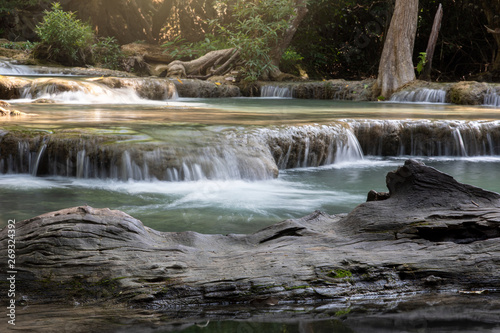 Old timber and waterfall background scene at  Huai Mae Khamin waterfall Kranchanaburi Thailand