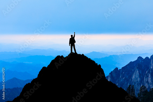 Happy man gesture of triumph with hands in the air,conceptual scene