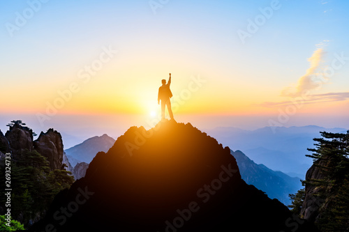 Happy man gesture of triumph with hands in the air,conceptual scene © ABCDstock