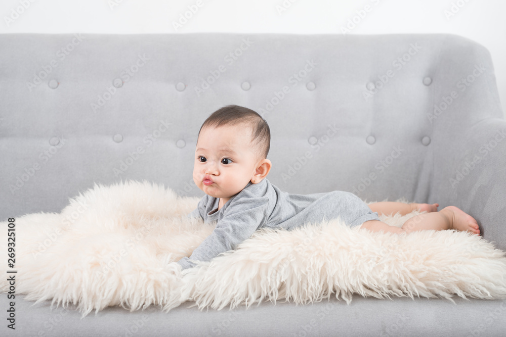 cute happy baby portrait lying on fur cute happy baby portrait lying on fur
