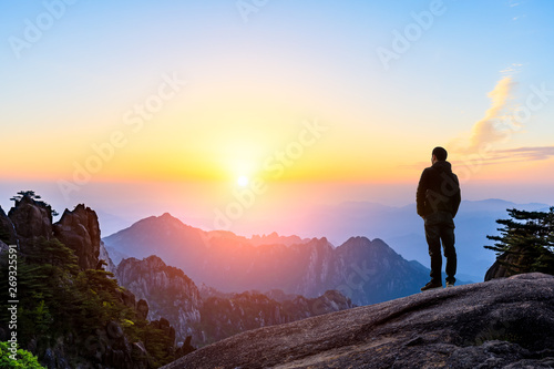 Man on top of mountain conceptual scene