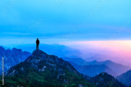 Man on top of mountain,conceptual scene