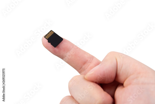 Hand with Micro SD card isolated on white background.