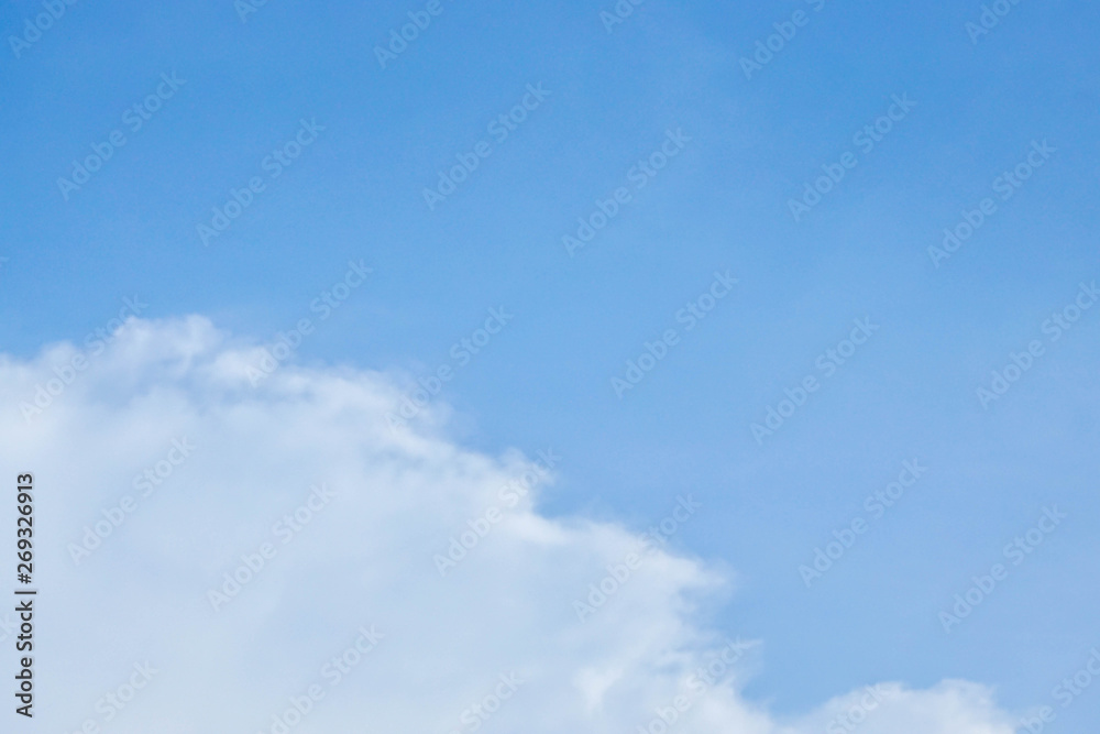nature background - white clouds in clear blue sky in summer season