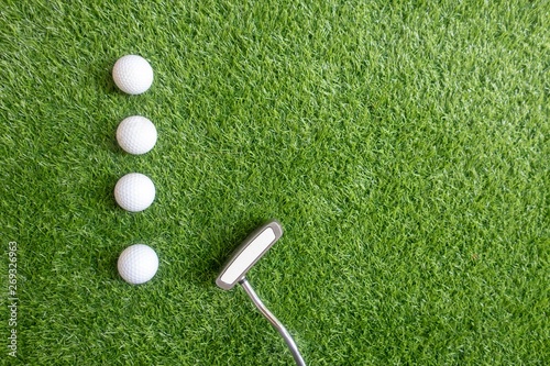 Golf balls are on green grass background