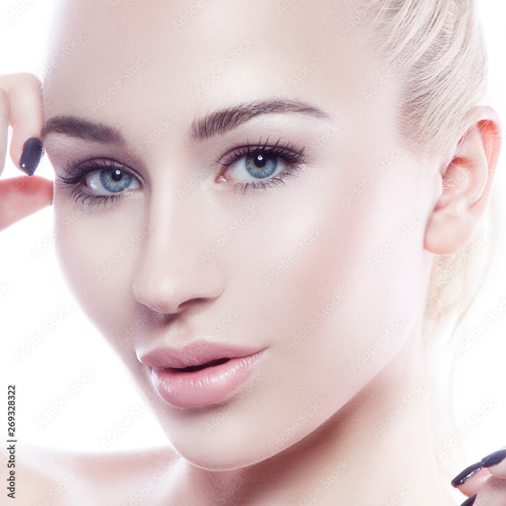 Close-up beauty of young woman with natural nude makeup, perfect skin, lip contouring