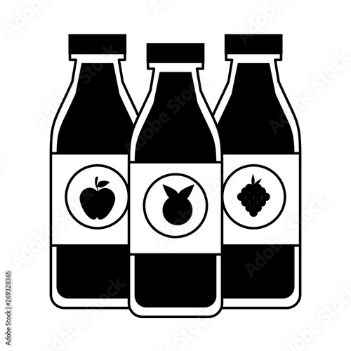 Fruits juices bottles in black and white