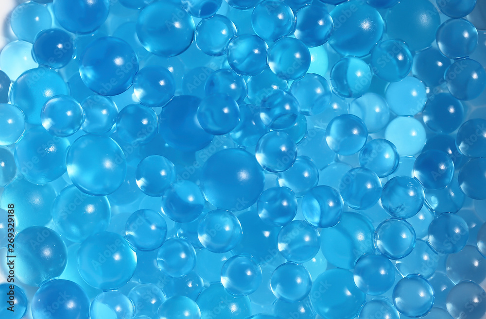 Water blue gel balls. Polymer gel. Silica gel. Balls of blue hydrogel. Crystal liquid ball with reflection. Texture background. Close up macro Water blue gel balls. Polymer gel. Silica gel. Balls of blue hydrogel. Crystal liquid ball with reflection. Texture background. Close up macro