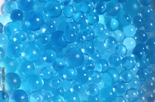 Water blue gel balls. Polymer gel. Silica gel. Balls of blue hydrogel. Crystal liquid ball with reflection. Texture background. Close up macro