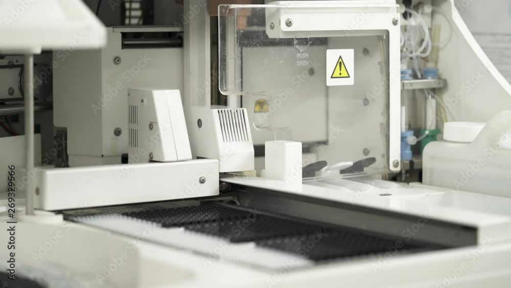 A close-up demonstration video of working automated analyzer. Laboratory hi tech medical equipment. Scientific and healthcare research concept. A close-up demonstration video of working automated analyzer. Laboratory hi tech medical equipment. Scientific and healthcare research concept.